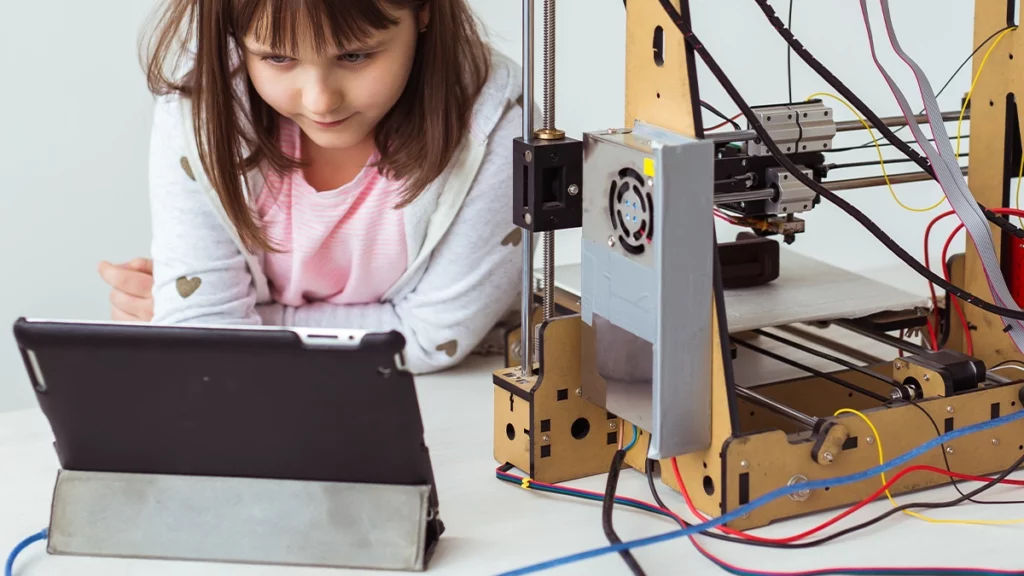 Girl making Cardboard Code DIY